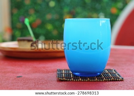Blue Glass of ice in table