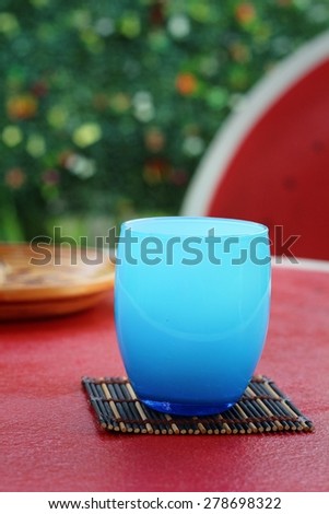 Blue Glass of ice in table