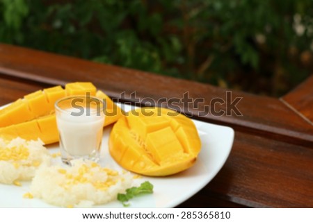 Blur Ripe mango and sticky rice with coconut milk