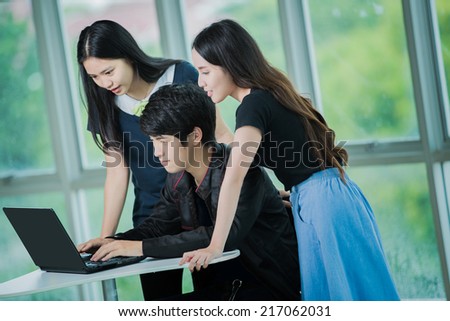 Asian student studying with laptop