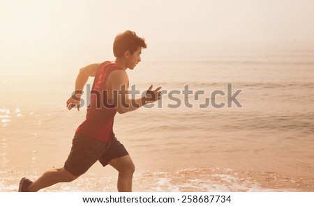Asian men were running Exercise in the morning, summer at the beach