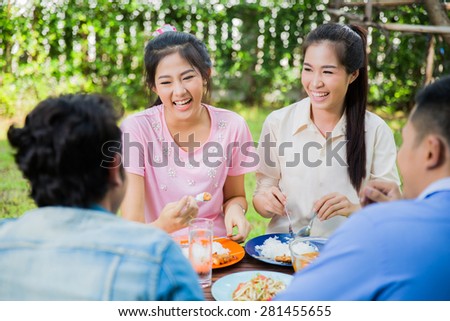 Two Asian woman Happy eating Thaifood in the garden area