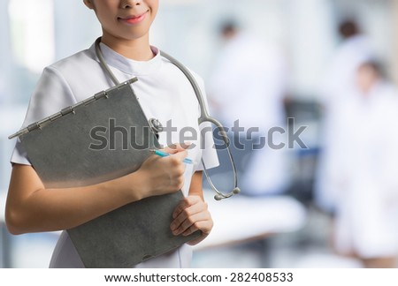 Asian nurse holding a steel file. To save the patient\'s situation hospital backdrop