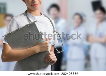 Asian nurse holding a steel file. To save the patient\'s situation hospital backdrop