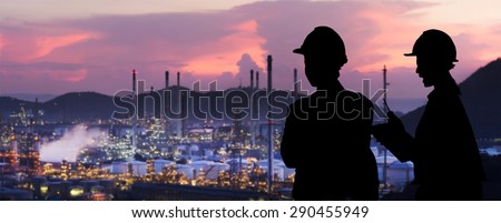 Silhouette engineers are standing orders The oil refining industry