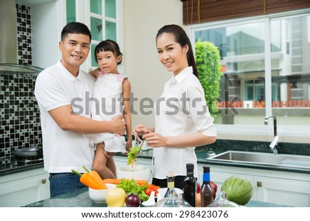 Asian family are cooking in the kitchen at home.