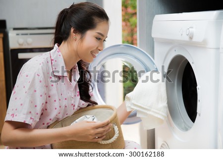 Women washing clothes The washing machine