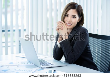 Business women are happy with the work the job in her company