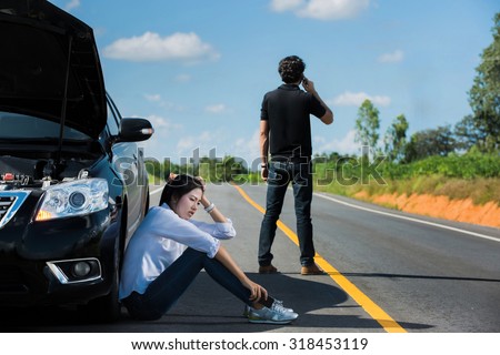Car broken street Man telephone call insurance. She had a stress