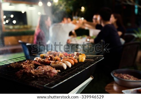 Dinner party, barbecue and roast pork at night