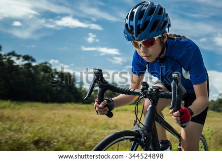 Woman Cycling outdoor exercise bike paths