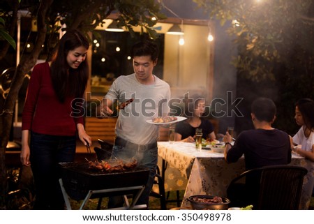Asian are doing barbecues and party at night