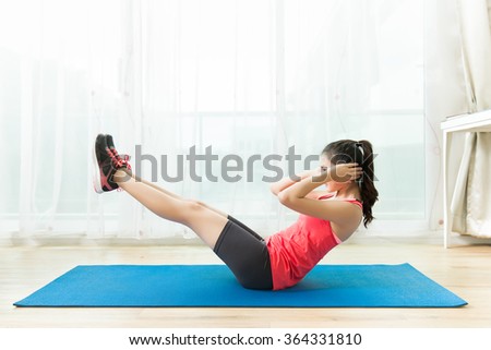 Asian women are exercising at home.Abdominal exercises Sit ups.
