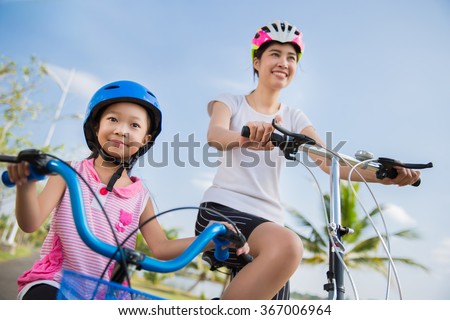 Mother and daughter are cycling exercise