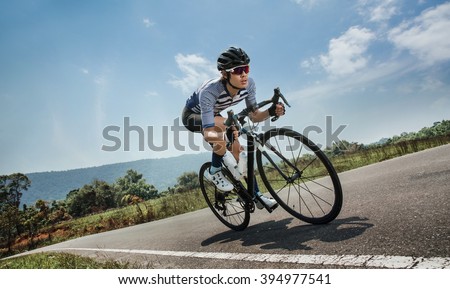 Asian men are cycling road bike in the morning