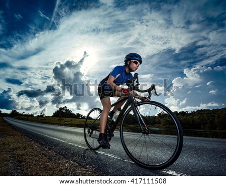 Woman cycling road bike outdoor exercise