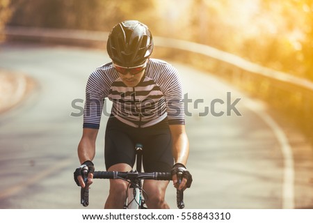 Asian men are cycling road bike in the morning