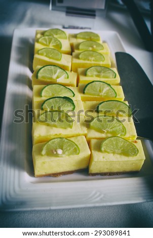 Photograph of a plate with a lemon pie dessert