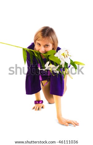 Young blonde on her knees with flowers in her mouth