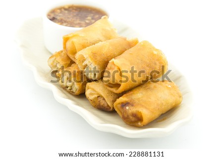 Spring rolls, Homemade egg rolls or Fried Chinese Traditional Spring rolls food with chili dipping sauce In Thai Restaurant.
