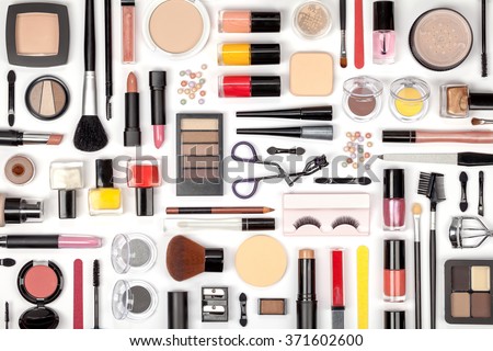 makeup cosmetics, brushes and other essentials on white background top view. beauty flat lay concept