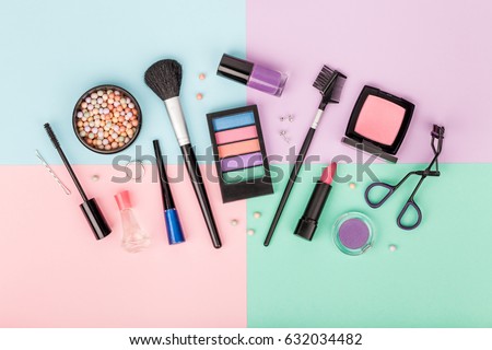 set of professional decorative cosmetics, makeup tools and accessory on colorful background. beauty and fashion concept. flat lay composition, top view