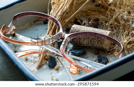 old eyes glasses with hay and cork