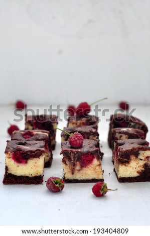Chocolate cream cheese brownies with raspberries, selective focus