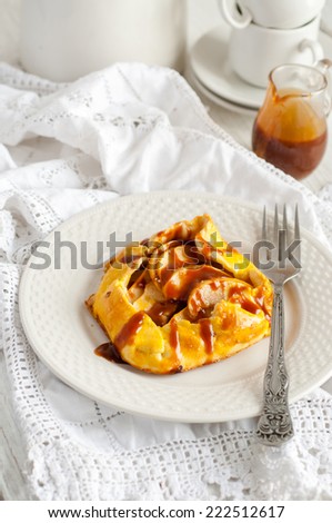 Apple pie with salted caramel sauce, selective focus