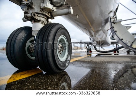 Embraer ERJ 145 aircraft landing gear on the runway