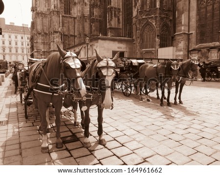 vintage horse coach transport in Vienna - modern fake sepia