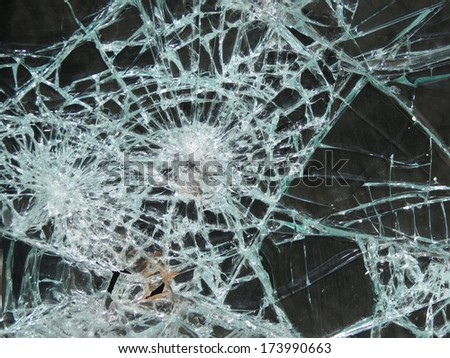 Smashed window glass useful as risk or danger concept