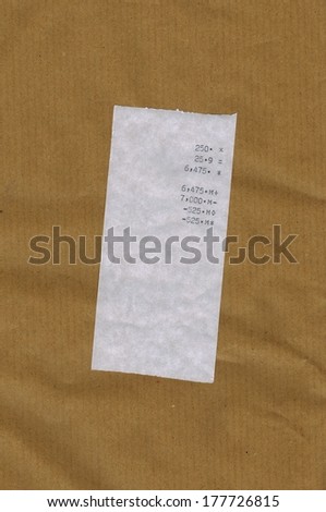 Bill or receipt isolated over light brown paper background