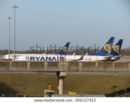 LONDON, UK - CIRCA JANUARY 2015:  Ryanair Jet aircrafts parked at the airport. Ryanair is the biggest low-cost airline company in the world.