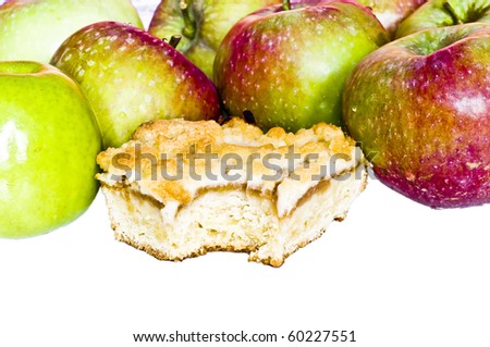 Bitten apple pie and red and green apples on white background