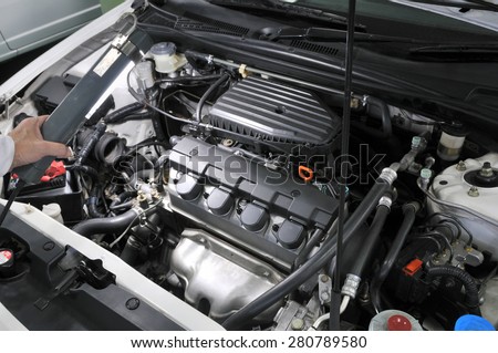 Maintenance of motor vehicles.\
It is made in Japan car of being repaired.