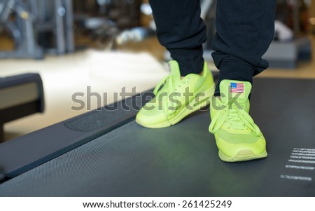 Workout on treadmill. Sneakers on a treadmill. Sports wear.