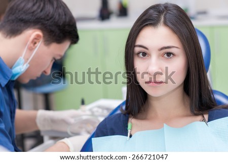 Healthy teeth and dental healthcare. Portrait of female patient at dentist office. She is waiting for her stomatologist doctor. Stomatology. Doctor stomatologist in medical clothing