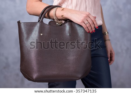 Bags fashion trends. Close up of gorgeous stylish bag. Fashionable woman is holding a trendy bag. Stylish trendy accessories concept