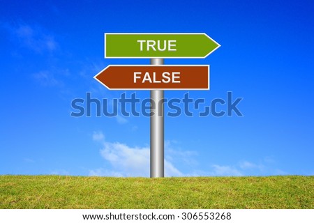 Street Sign showing true or false in front of blue sky on green grass