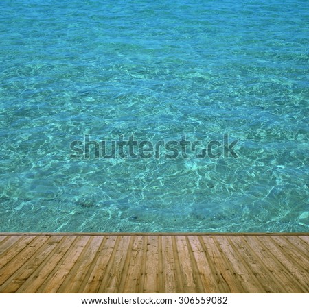 Brown wooden boards with clear blue water