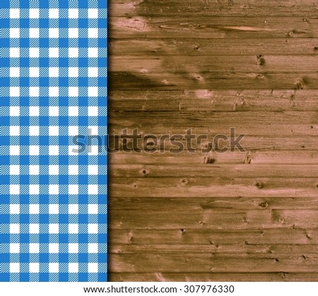 Traditional vintage background with wooden planks and blue white tablecloth