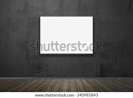 Dark room with wooden floor and empty picture on the wall