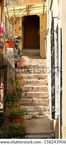 Stone steps to doorway in a small French town.