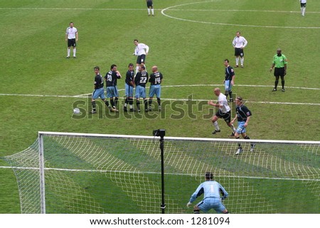 Goal.Preston player bends a free kick around the Leeds defense.