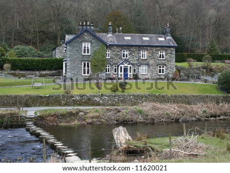 Typical Lake District House by the River Rothay, with stepping stones, Cumbria.