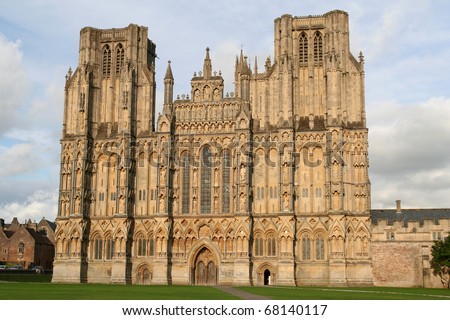 The facade of Wells Cathedral bathed in early evening light.