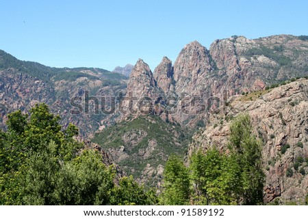 Unusual Rhino Horn shaped peaks on a Corsican Mountain. Dramatic mountain landscape in the interior of the French island of Corsica.