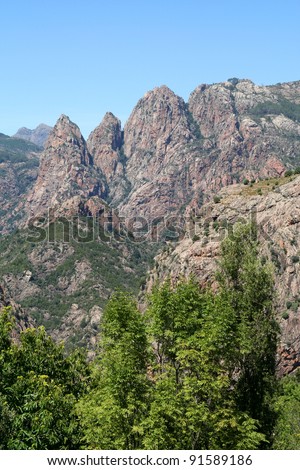 Unusual Rhino Horn shaped peaks on a Corsican Mountain. Dramatic mountain landscape in the interior of the French island of Corsica.