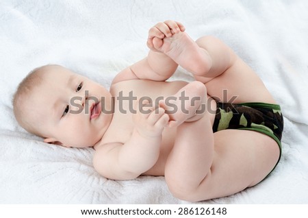 Baby plays with his feet
